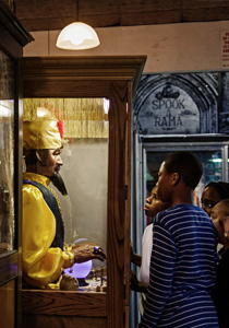 fortune teller machine with customers from side